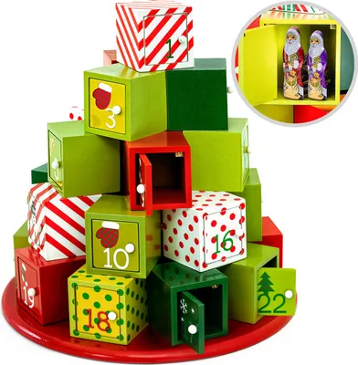 A Christmas advent calendar made of wooden blocks stacked in a tree shape, with some doors open.