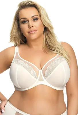 A woman is wearing a white bra.