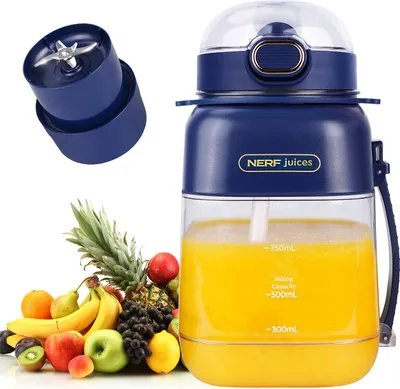 A portable blender with a collection of fresh fruits next to it.