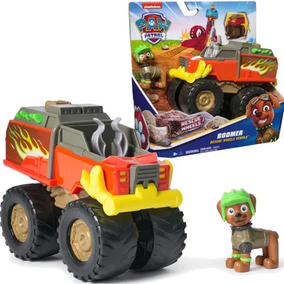 A Paw Patrol Rescue Wheels Boomer toy vehicle and figure are displayed, with the vehicle in the foreground and the packaged toy in the background.