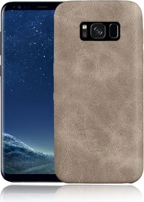 A smartphone with a beige leather-look case is shown from the back, with the phone's screen displaying a starry night sky and landscape.