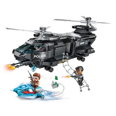 A toy police helicopter with two figures and a small vehicle.