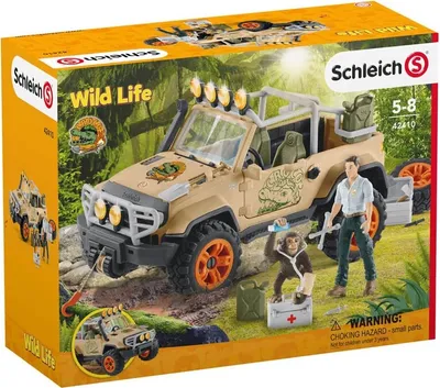 A toy playset of a safari jeep with figures and accessories, presented on its retail packaging.