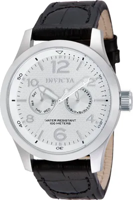 A close-up studio shot of a men's wristwatch with a silver dial and black leather strap.