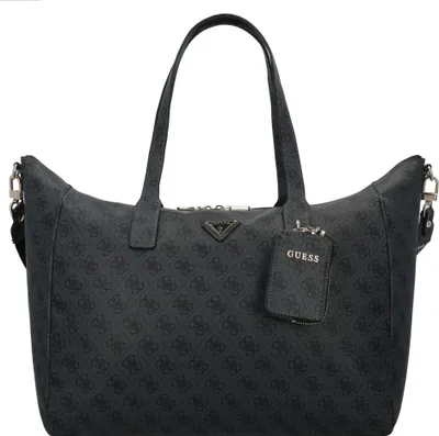 A studio shot of a black GUESS shopper bag with a repeating logo pattern.