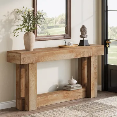 A wooden console table with decorative items in a hallway setting.