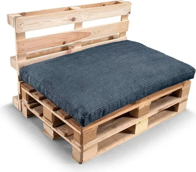 A dark blue cushion set on a wooden pallet sofa.