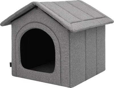 A gray fabric dog house with an arched entrance.