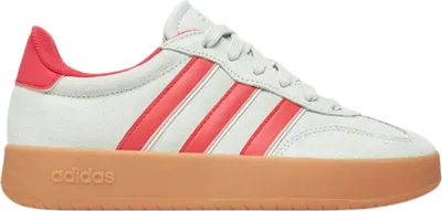 A side view of a single Adidas sneaker.