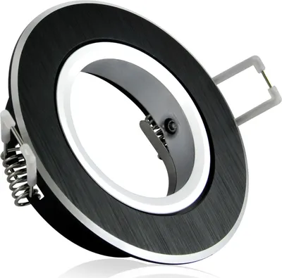 A close-up studio shot of a black and silver recessed light fixture with springs for installation.