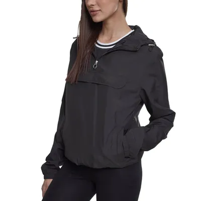 A woman wearing a black windbreaker.