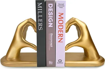 Produktbild von Goldene, herzförmige Buchstützen für eine besondere Inneneinrichtung im Wohnzimmer oder Schlafzimmer