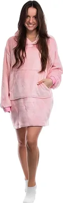 A woman wearing a pink hoodie blanket.