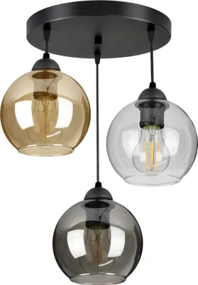 A pendant light fixture with three glass globes of different colors.
