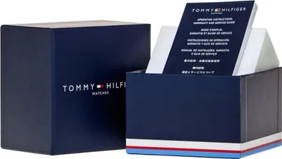 A Tommy Hilfiger watch box and its contents, including an instruction manual.