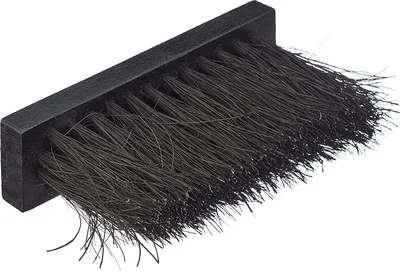 A close-up, isolated shot of a black brush with dark bristles.
