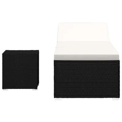 A black poly rattan sun lounger with a white cushion and a matching black poly rattan side table, shown against a white background.