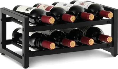 A black metal wine rack holding eight bottles of red wine.