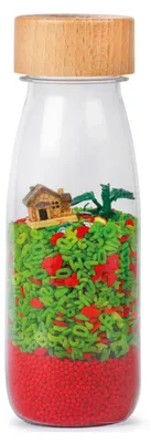 Productafbeelding van Sinnesfles "Dragon" met geluid - 14 x 4 cm - Meerdere kleuren | van Petit Boum