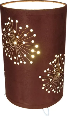 A brown cylindrical table lamp with a cutout dandelion-like pattern illuminated from within.