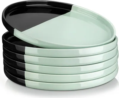 A stack of plates with a two-tone color design.