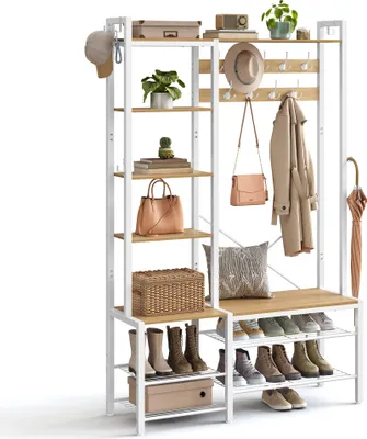 A white and wood coat rack and shoe bench with various items displayed on it.