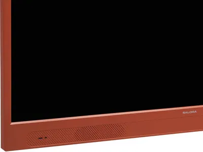 A close-up view of the bottom right corner of an orange television set.