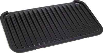 A black grill plate with raised ridges.