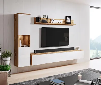 A modern living room with a wall-mounted entertainment unit and TV.