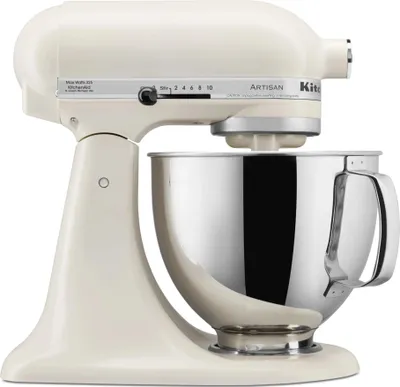 A cream-colored KitchenAid Artisan stand mixer with a silver bowl is shown against a white background.
