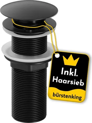 A black sink drain assembly with a pop-up stopper and a yellow tag attached.