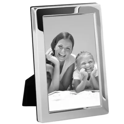 A silver picture frame with a black stand, displaying a black and white photo of a woman and a child.