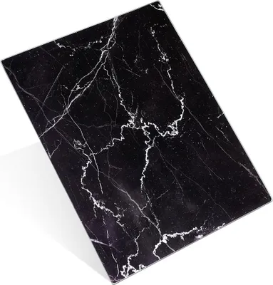 A black cutting board with white marble-like veins, shown at an angle on a white background.