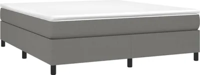 A studio shot of a box spring bed.
