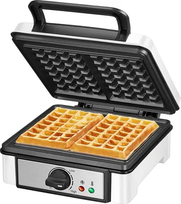A white and black waffle maker with two waffles inside, set against a white background.