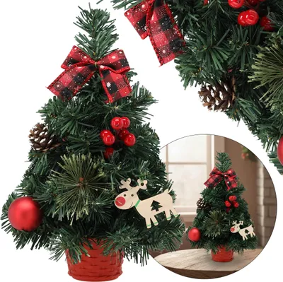A decorated artificial Christmas tree with a red pot and a reindeer ornament.
