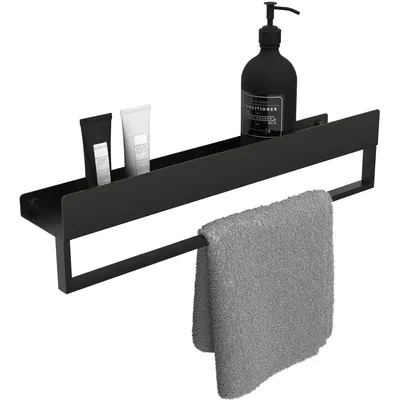 A black bathroom shelf with a towel rack, holding two small tubes and a large pump bottle, with a gray towel hanging from the rack.