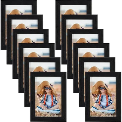 Immagine prodotto di Cornici per foto 10x15 cm, colore nero, set da 12 pezzi, adatte per essere appese al muro o posizionate su un tavolo