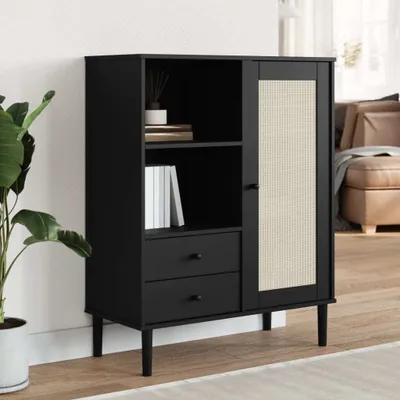 A black highboard with rattan-optic doors and drawers, placed in a room setting.
