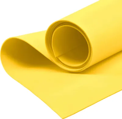A roll of yellow foam material on a white background.