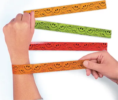 Produktbild von Lachende Gesichter Schnapp Armbänder Mitgebsel 12 Stück