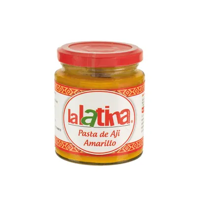 A jar of yellow chili paste with a red lid.