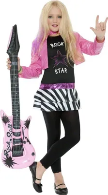 A young girl dressed in a rockstar costume holding an inflatable guitar.