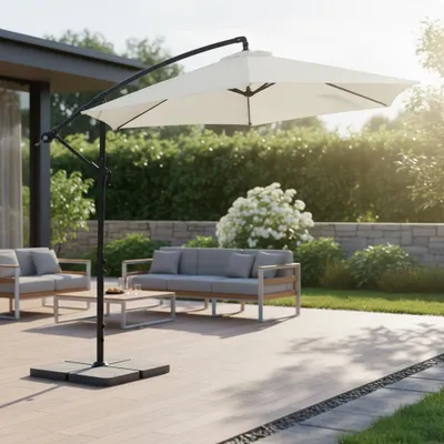 An outdoor patio with furniture and a large cantilever umbrella.