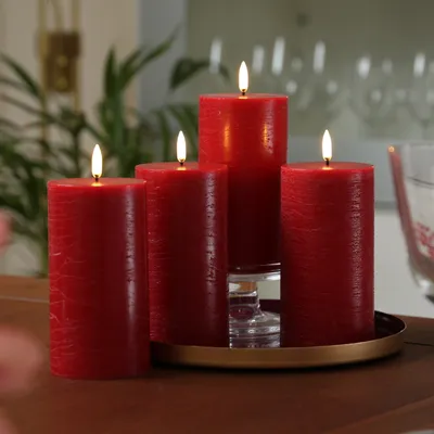 Produktbild von LED Kerzenset PIA - Rustik-Optik - H: 15cm - inkl. Batterien und Fernbedienung - rot - 4er Set
