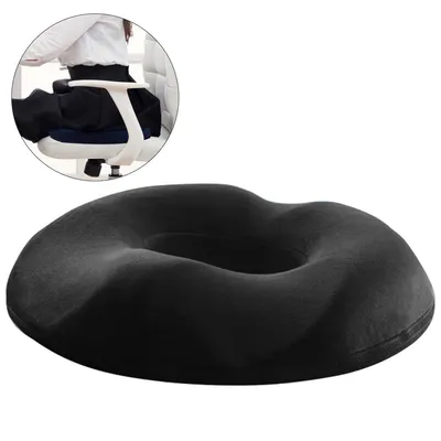 A black seat cushion is shown in the foreground, with a circular inset image showing a person sitting on a chair with the cushion.