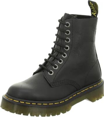A black Dr. Martens boot is shown against a white background.