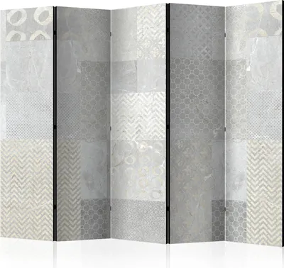 A multi-panel room divider with a tile-like pattern in shades of gray and white.