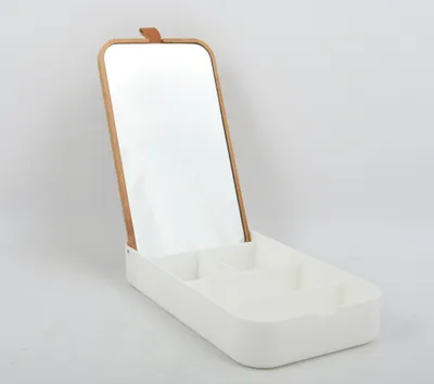 A white cosmetic organizer with a mirror and wooden frame, displayed against a light gray and white background.