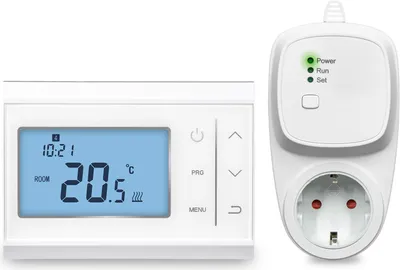 A white digital thermostat and a white wireless socket adapter are shown side-by-side on a white background.